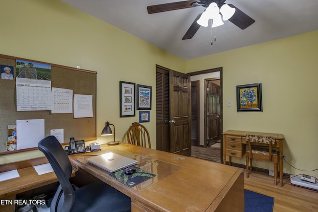 office space with ceiling fan and wood finished floors