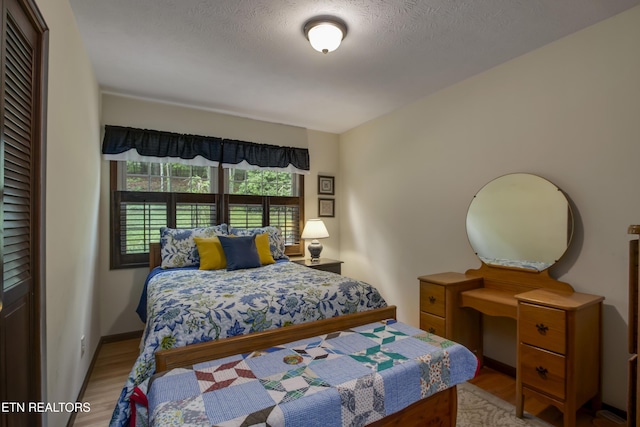 bedroom with light wood-type flooring