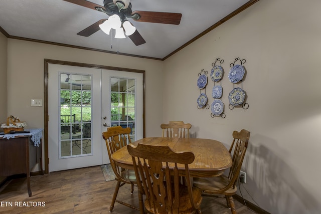 dining space with crown molding, ceiling fan, french doors, and wood finished floors