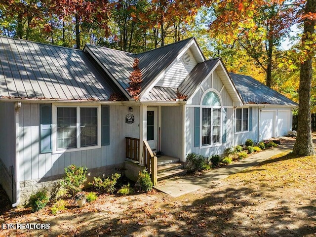 1703 Perimeter Dr, Jamestown, TN 38556 - ranch-style home featuring a garage, a standing seam roof, and metal roof
