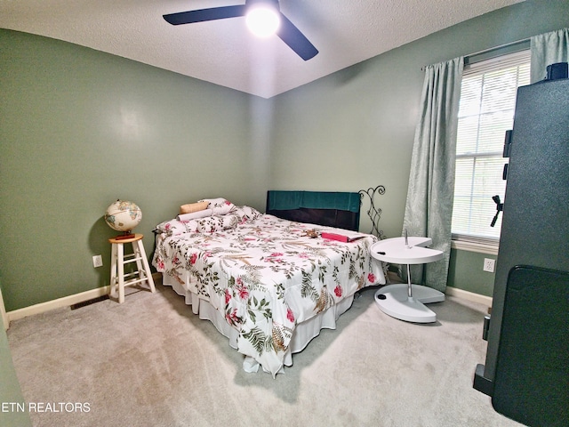 1703 Perimeter Dr, Jamestown, TN 38556 - carpeted bedroom featuring multiple windows, ceiling fan, and baseboards