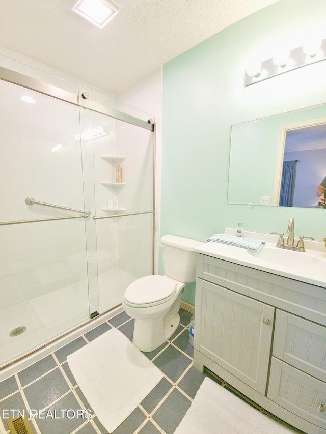 1703 Perimeter Dr, Jamestown, TN 38556 - bathroom with vanity, toilet, and a stall shower