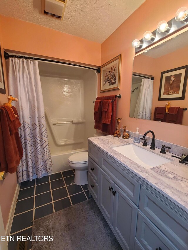 1703 Perimeter Dr, Jamestown, TN 38556 - full bathroom with a textured ceiling, shower / tub combo with curtain, toilet, tile patterned floors, and vanity