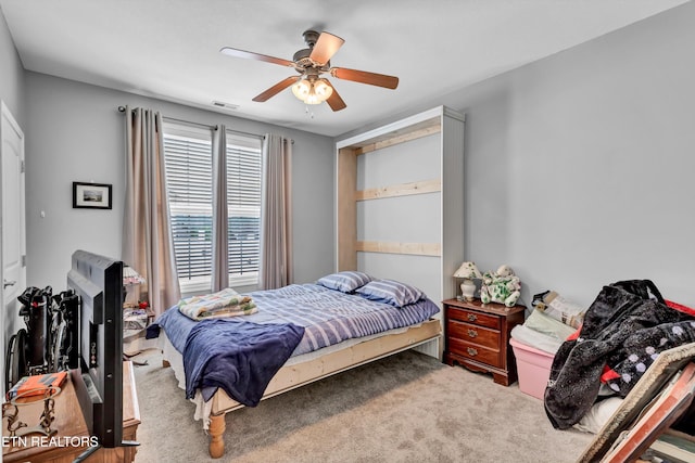 bedroom featuring carpet, visible vents, and a ceiling fan