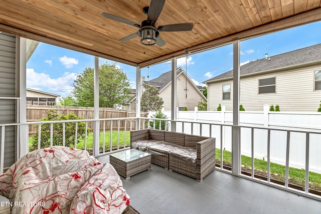sunroom with ceiling fan and an outdoor hangout area