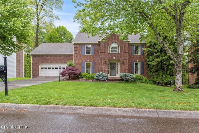 colonial house featuring driveway, roof with shingles, brick siding, a front lawn, and a garage