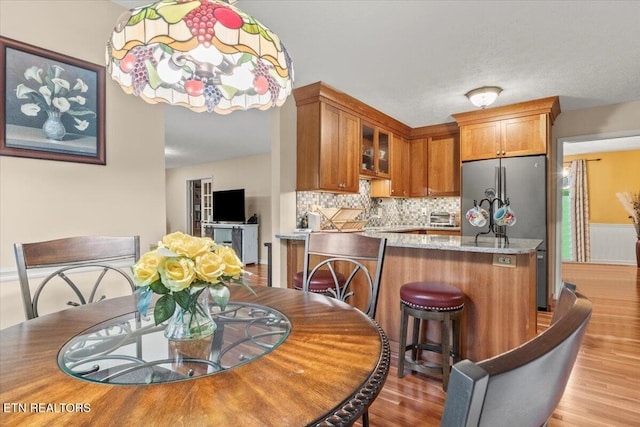 dining area with light wood-type flooring