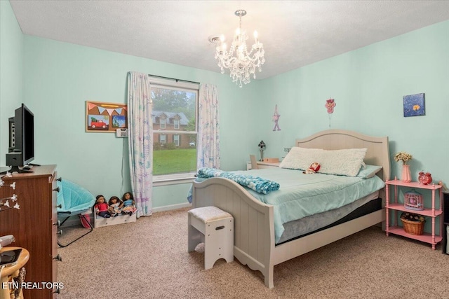 carpeted bedroom with a chandelier