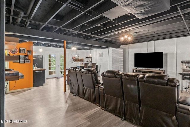 cinema with wood finished floors and french doors