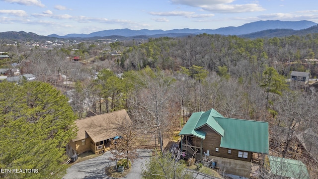 drone / aerial view with a view of trees and a mountain view