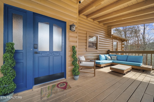 wooden terrace featuring outdoor lounge area