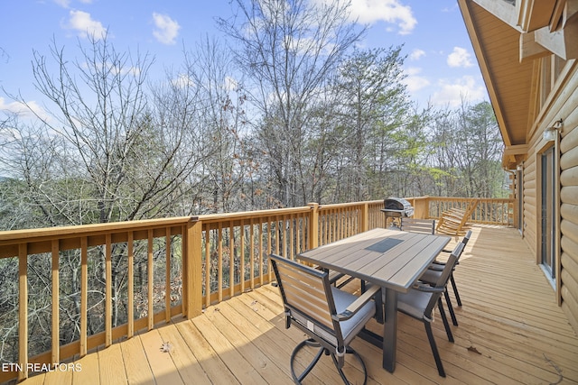 deck featuring outdoor dining area