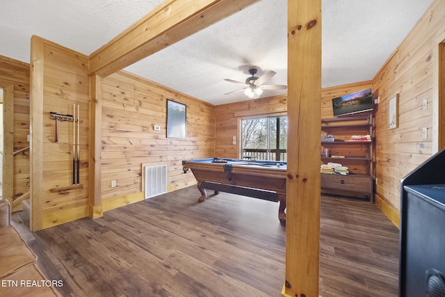 rec room with wooden walls, billiards, a textured ceiling, and visible vents
