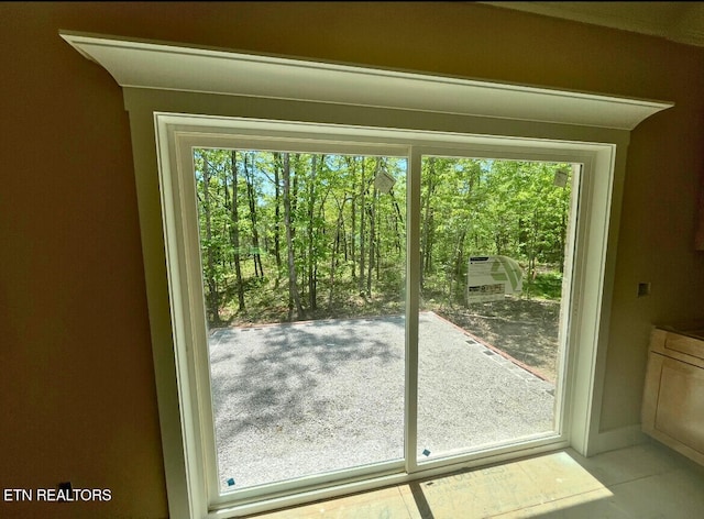 doorway to outside featuring a healthy amount of sunlight