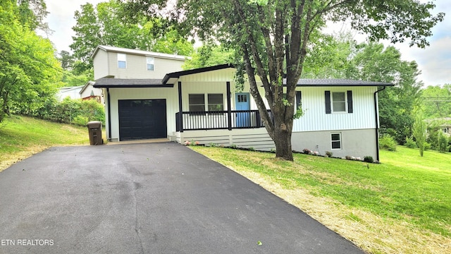 1805 Ferd Hickey Rd, Knoxville, TN 37909 - view of front of home with a front lawn, a garage, and aphalt driveway