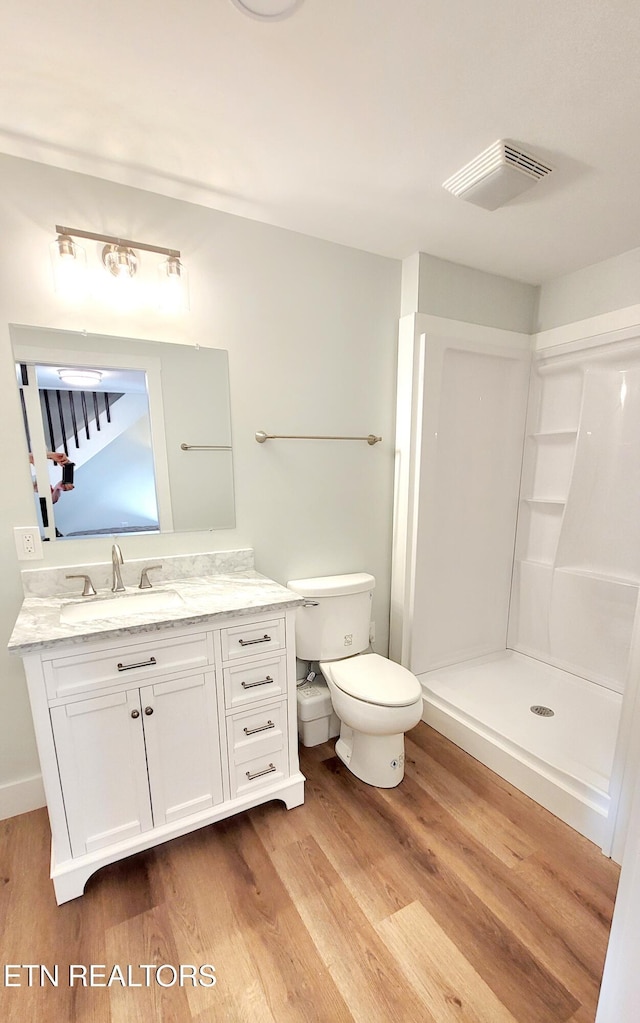 1805 Ferd Hickey Rd, Knoxville, TN 37909 - full bathroom featuring vanity, toilet, visible vents, and wood finished floors