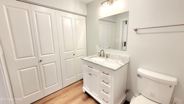 1805 Ferd Hickey Rd, Knoxville, TN 37909 - bathroom featuring vanity, toilet, a closet, and wood finished floors