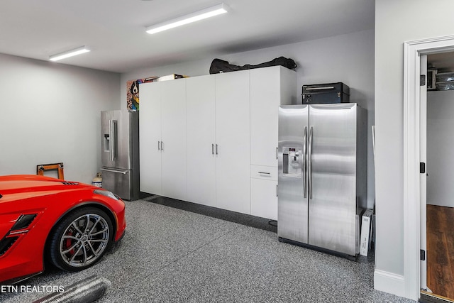 8947 Linksvue Dr, Knoxville, TN 37922 - garage featuring stainless steel fridge