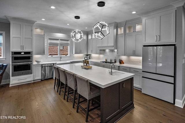 8947 Linksvue Dr, Knoxville, TN 37922 - kitchen featuring dark wood-type flooring, a sink, stainless steel appliances, and light countertops