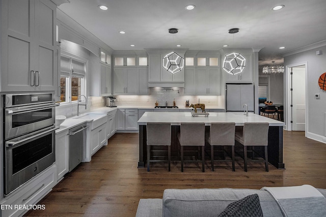 8947 Linksvue Dr, Knoxville, TN 37922 - kitchen with a sink, stainless steel appliances, glass insert cabinets, tasteful backsplash, and light countertops