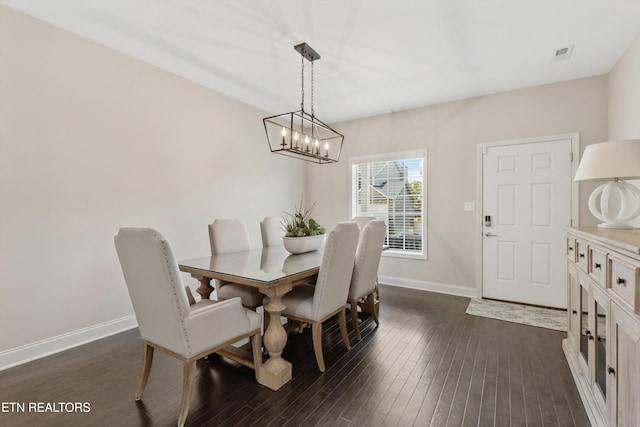 6749 Albatross Ln, Knoxville, TN 37921 - dining area featuring a chandelier, baseboards, and dark wood-style flooring