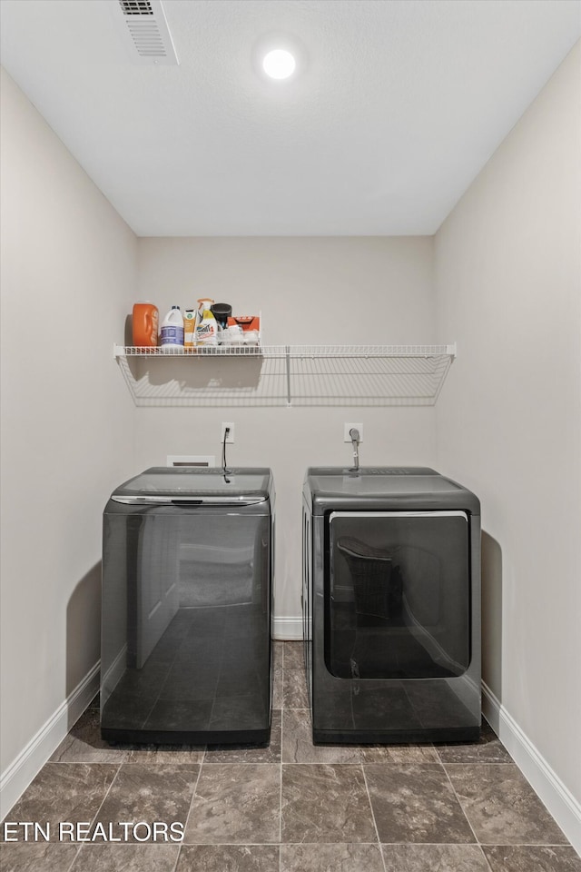 6749 Albatross Ln, Knoxville, TN 37921 - laundry area with washer and clothes dryer and baseboards