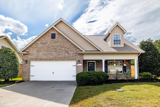 view of front facade with brick siding, a garage, a front lawn, and driveway