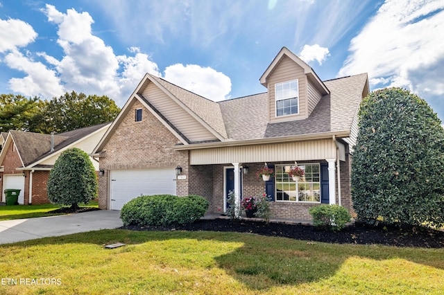 view of front of property with a front yard, roof with shingles, brick siding, concrete driveway, and an attached garage