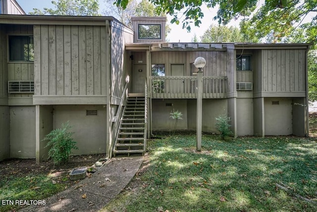 67 Eagle Ct, Crossville, TN 38558 - rear view of house featuring a yard, stairs, and crawl space