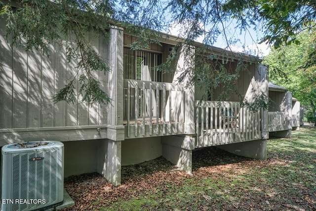 67 Eagle Ct, Crossville, TN 38558 - view of side of home with cooling unit and a wooden deck