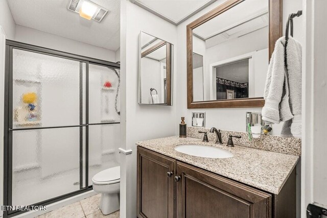 67 Eagle Ct, Crossville, TN 38558 - bathroom with vanity, tile patterned floors, toilet, a stall shower, and visible vents