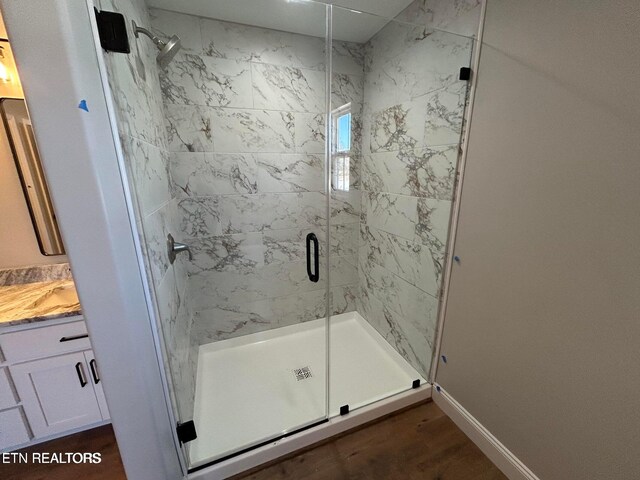 257 Colby Cir, Crossville, TN 38571 - full bathroom with wood finished floors, a shower stall, and vanity