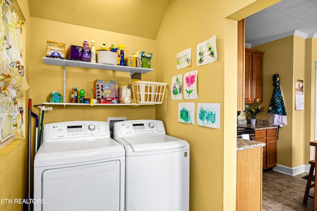 washroom featuring crown molding, laundry area, dark wood-style floors, and washing machine and clothes dryer