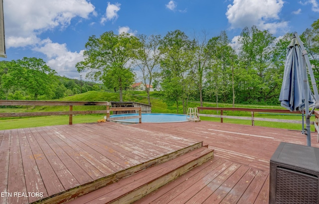 wooden deck with a yard
