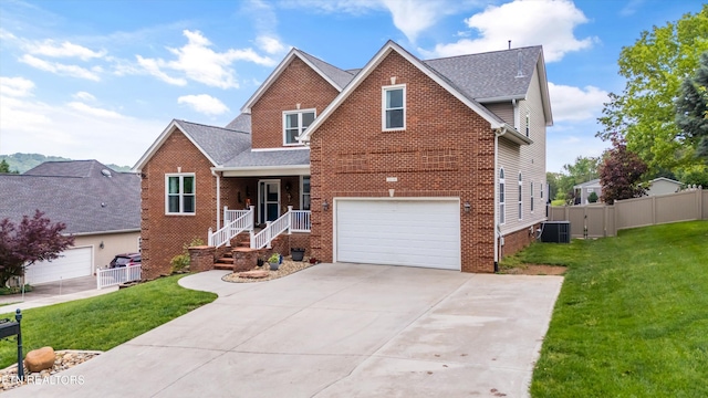 traditional-style home featuring a porch, brick siding, fence, and a front lawn