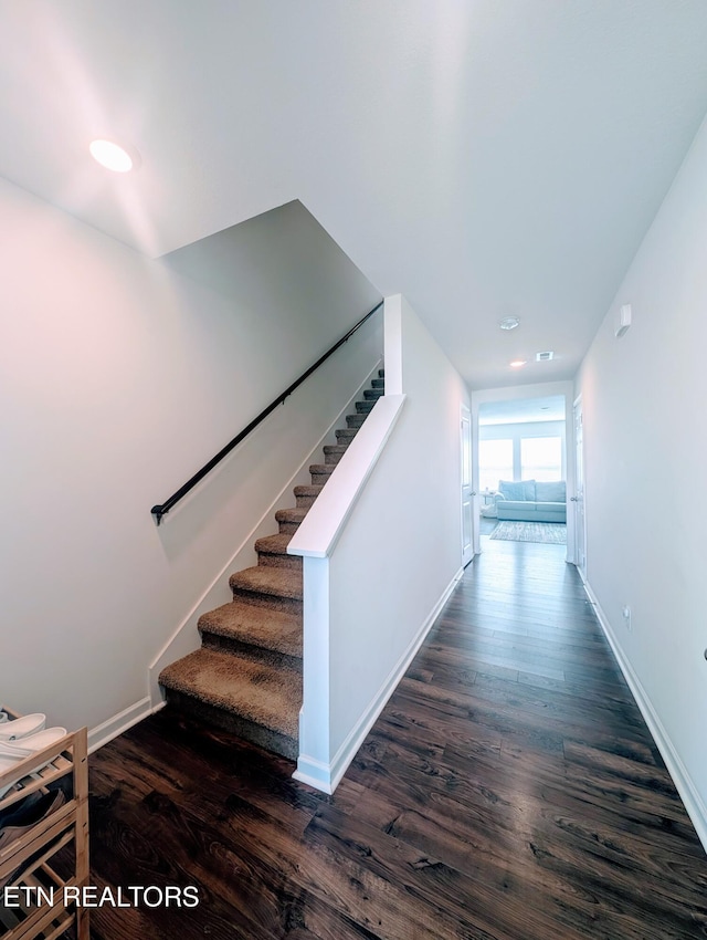 stairs featuring recessed lighting, baseboards, and wood finished floors