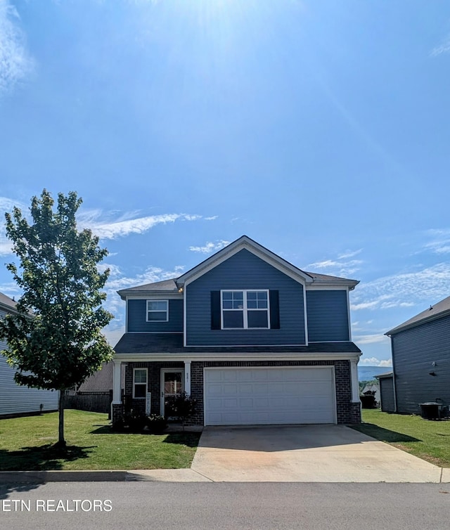 view of front of property with concrete driveway, an attached garage, a front lawn, and brick siding