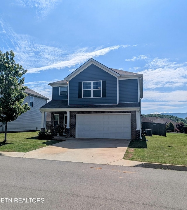 view of front of property with concrete driveway, brick siding, a front yard, and a garage