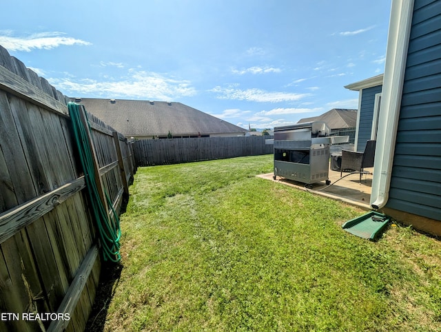 view of yard with a fenced backyard