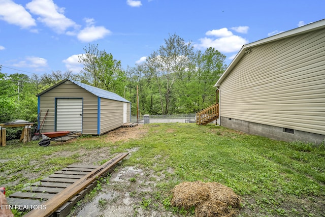 301 Hill St, Rocky Top, TN 37769 - view of yard with an outdoor structure, a shed, and fence