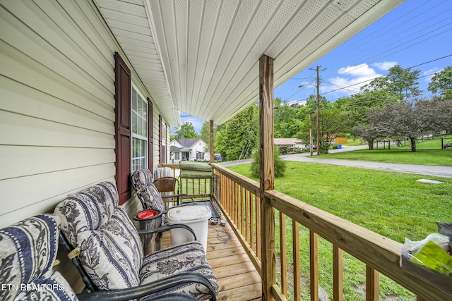301 Hill St, Rocky Top, TN 37769 - wooden terrace with a lawn and covered porch