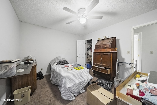 301 Hill St, Rocky Top, TN 37769 - bedroom featuring baseboards, dark carpet, a ceiling fan, and a textured ceiling