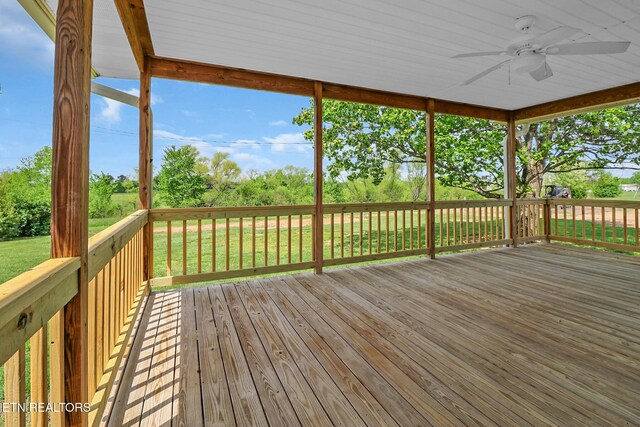 1228 Allardt Hwy, Jamestown, TN 38556 - wooden terrace featuring ceiling fan, a lawn, and view of scattered trees
