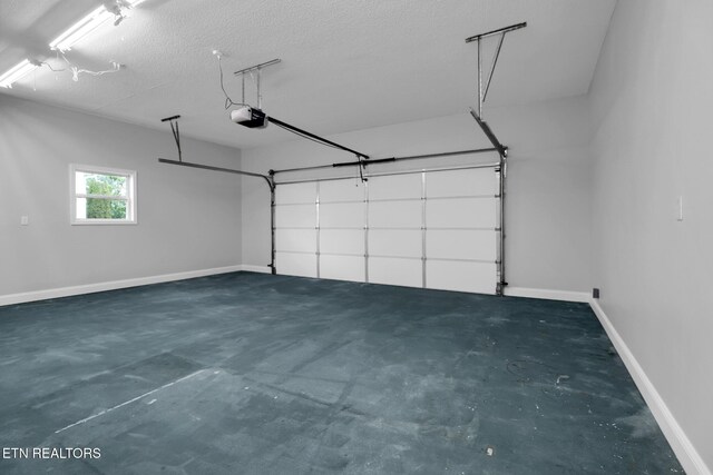 1228 Allardt Hwy, Jamestown, TN 38556 - garage featuring a garage door opener and baseboards