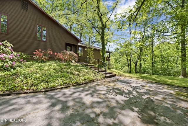 view of side of property featuring a patio
