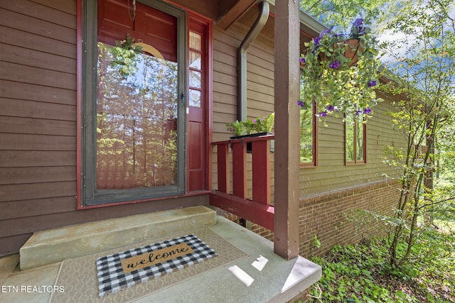 doorway to property with a porch