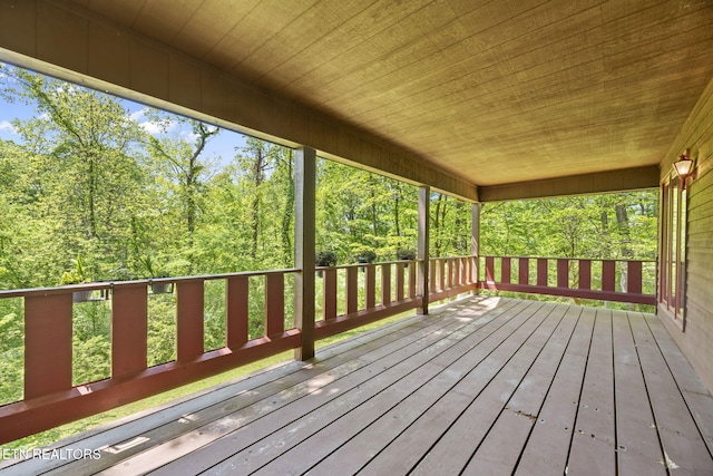 deck featuring a forest view
