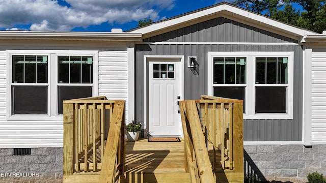 2128 Duncan Rd, Maryville, TN 37803 - property entrance featuring crawl space, board and batten siding, and a deck
