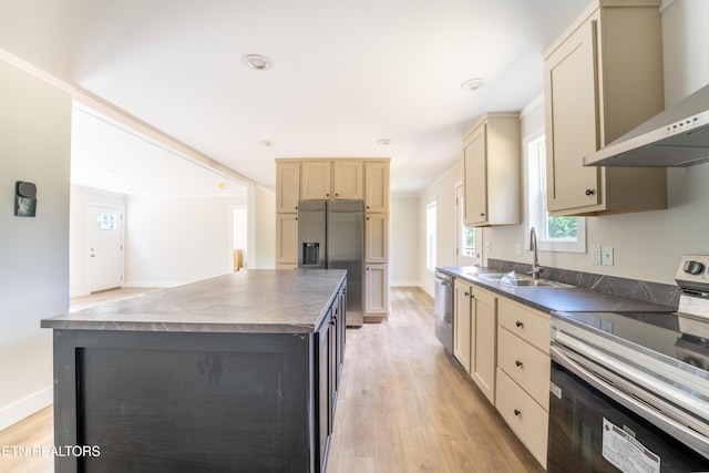 2128 Duncan Rd, Maryville, TN 37803 - kitchen with appliances with stainless steel finishes, wall chimney range hood, a sink, light wood finished floors, and recessed lighting