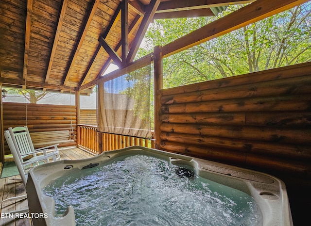 exterior space with a hot tub